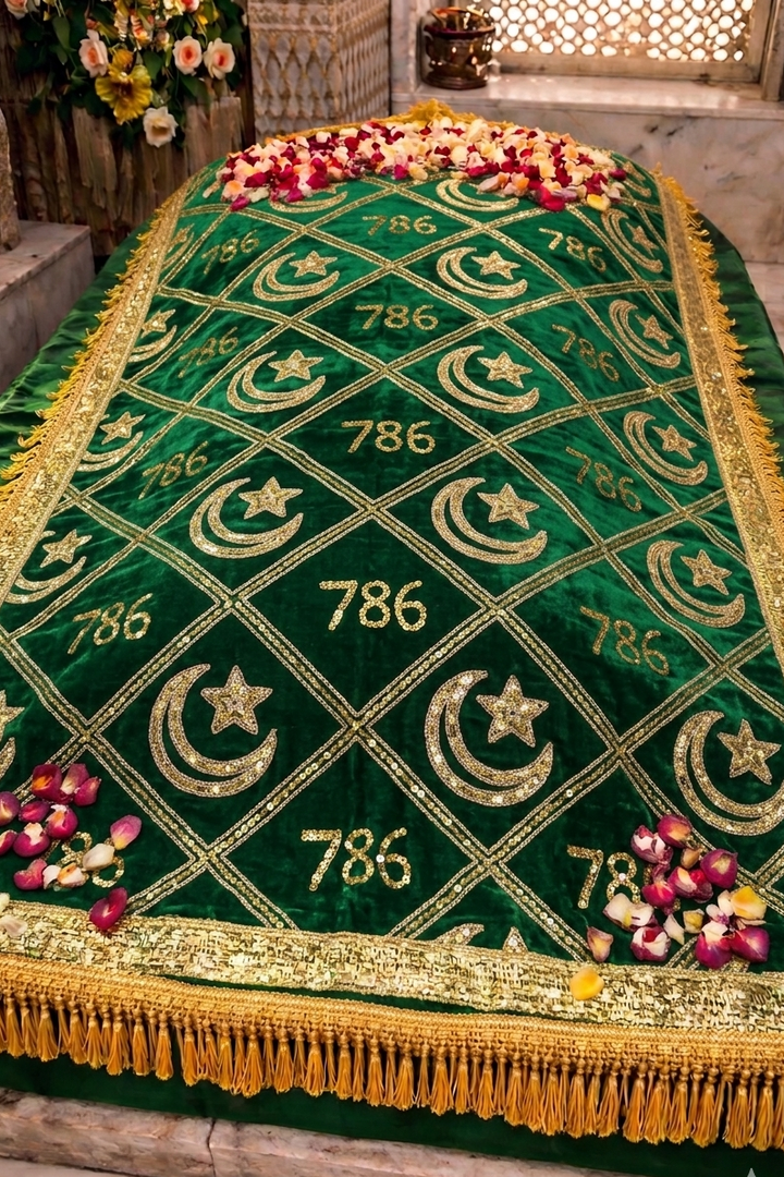 Green embroidered cloth with gold patterns and numbers, placed on a stone surface.


