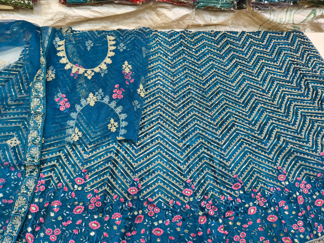 Teal Blue Unstitched Embroidered Net Lehenga Choli with Floral Border & Dupatta