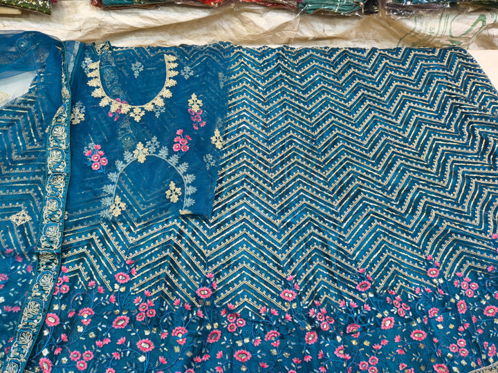 Teal Blue Unstitched Embroidered Net Lehenga Choli with Floral Border & Dupatta