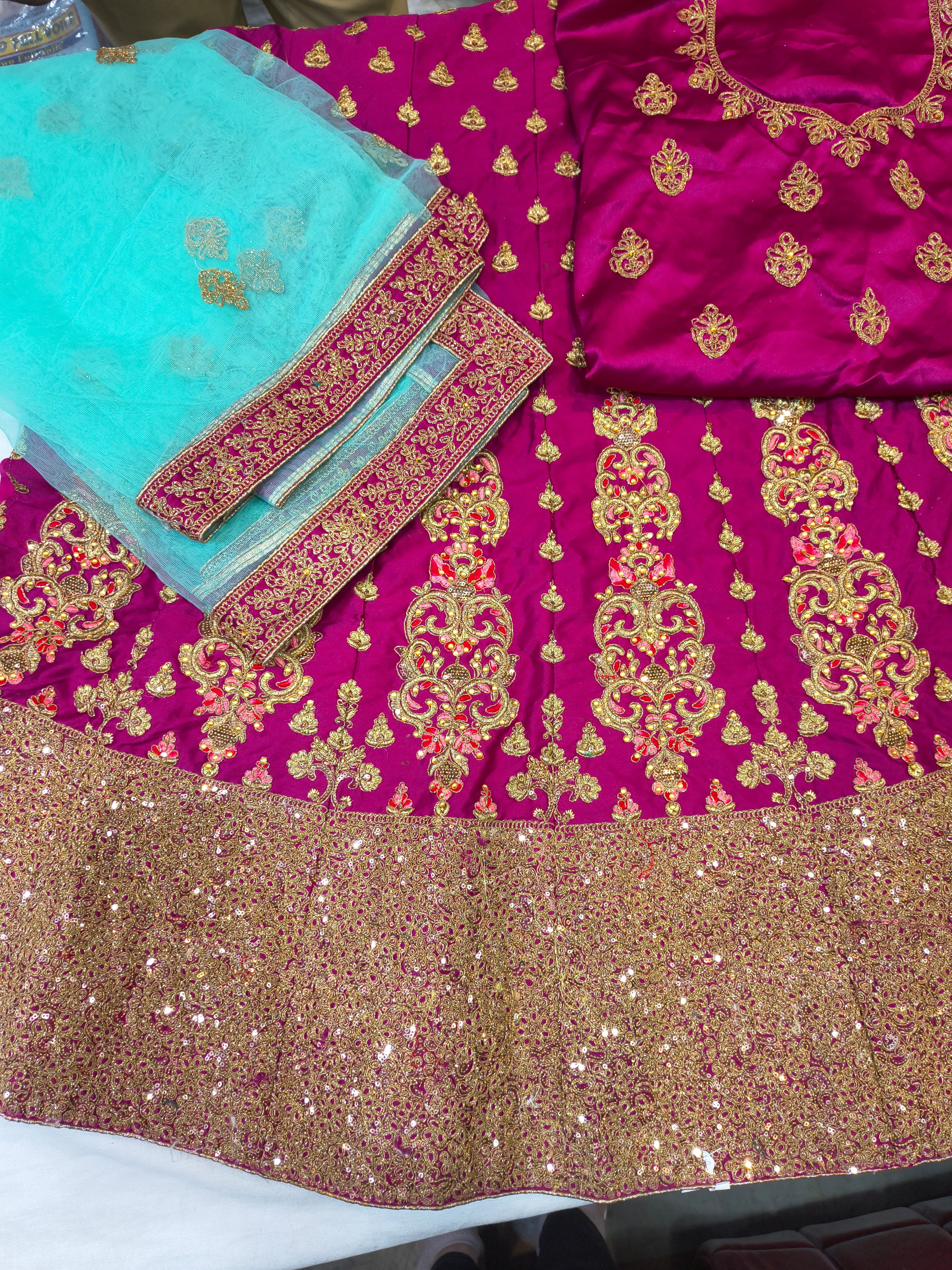 Magenta Satin Silk Unstitched Lehenga Choli with Aqua Net Dupatta